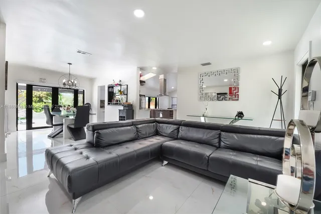 a kitchen with stainless steel appliances a refrigerator sink and stove