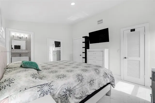 a bathroom with a toilet sink and shower