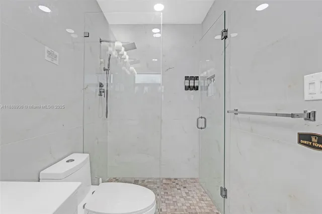 a living room with a bed furniture and a window