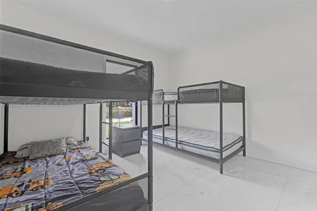 a view of bedroom with furniture and window