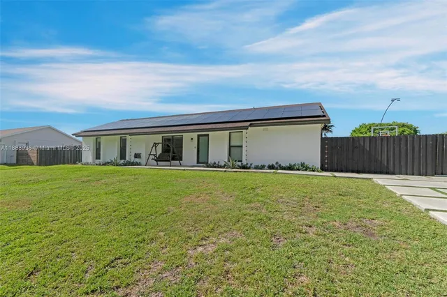 a view of a house with sitting area and roof