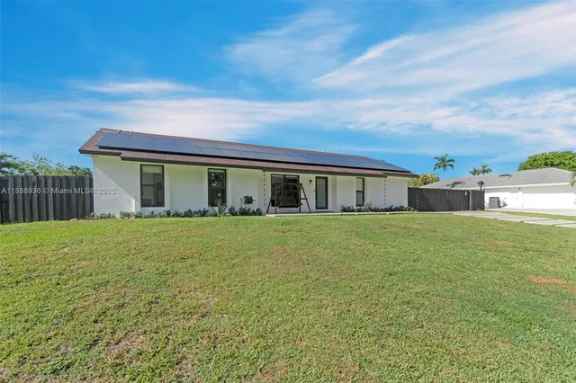 a view of a fence and a floor to ceiling window