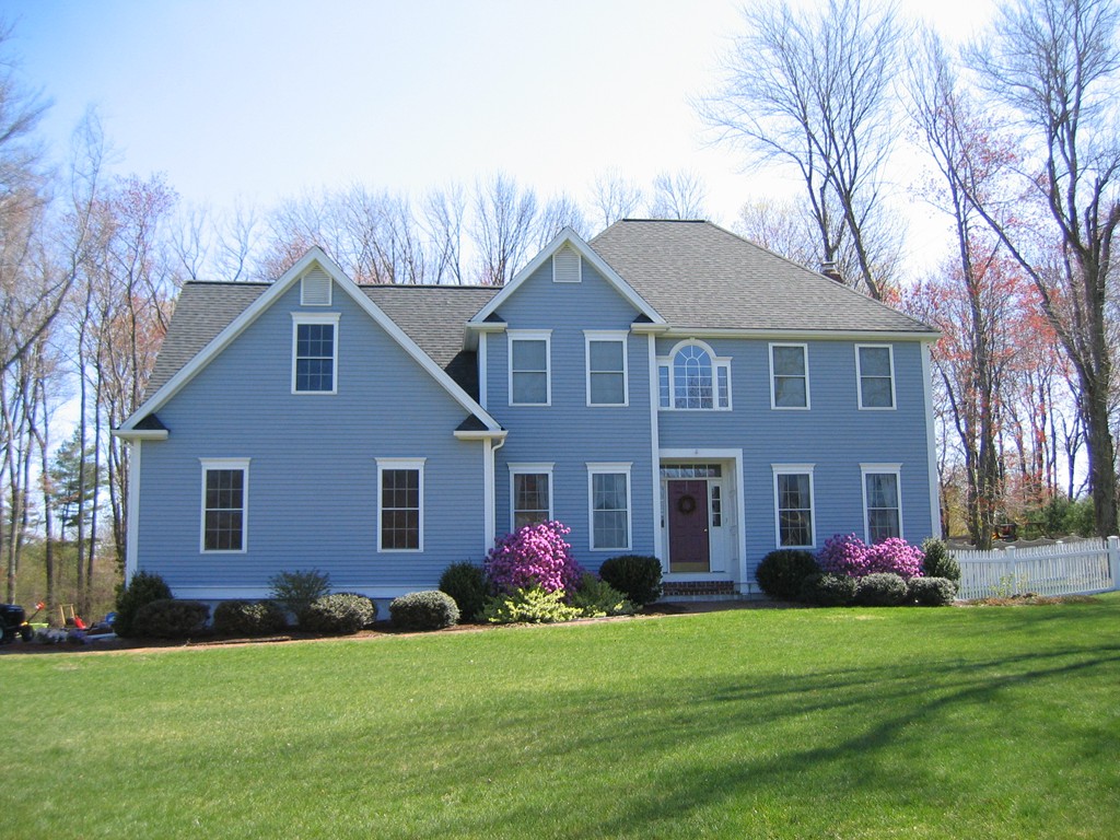 a front view of the house with yard and green space