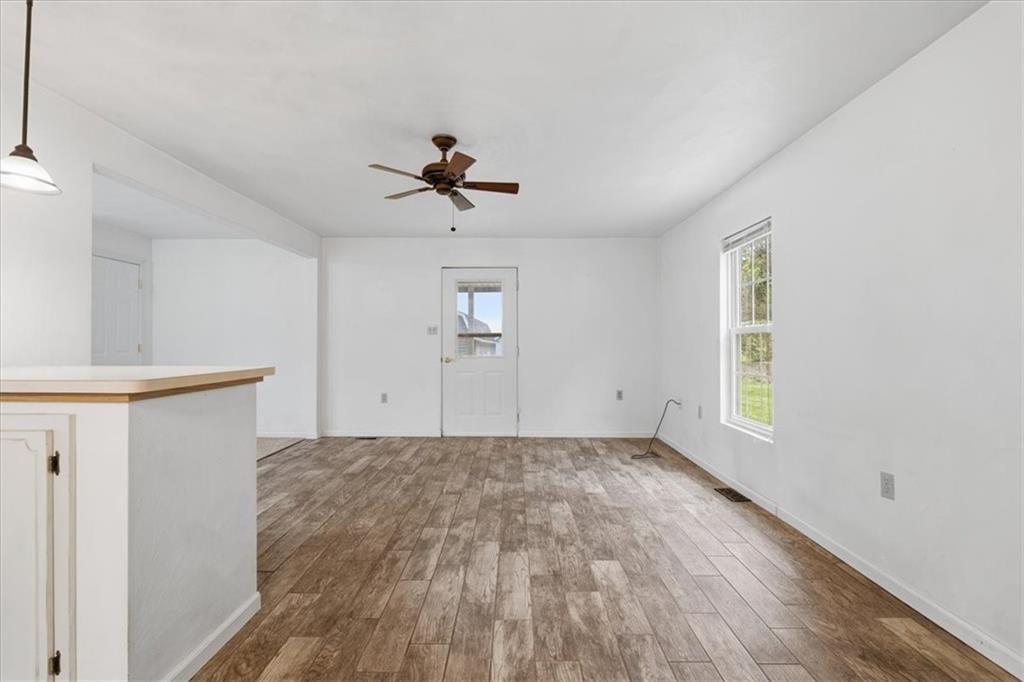 470 Reidmore Road Connellsville, PA 15425 - Photo 13 of 29 a view of empty room with wooden floor and fan