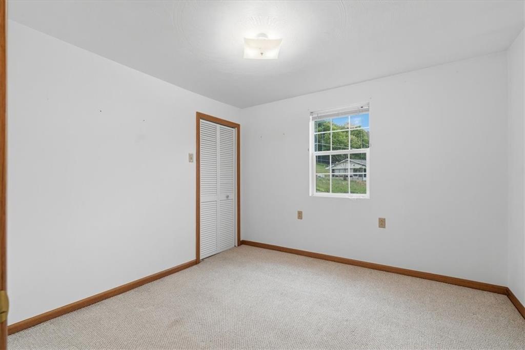 470 Reidmore Road Connellsville, PA 15425 - Photo 23 of 29 an empty room with windows