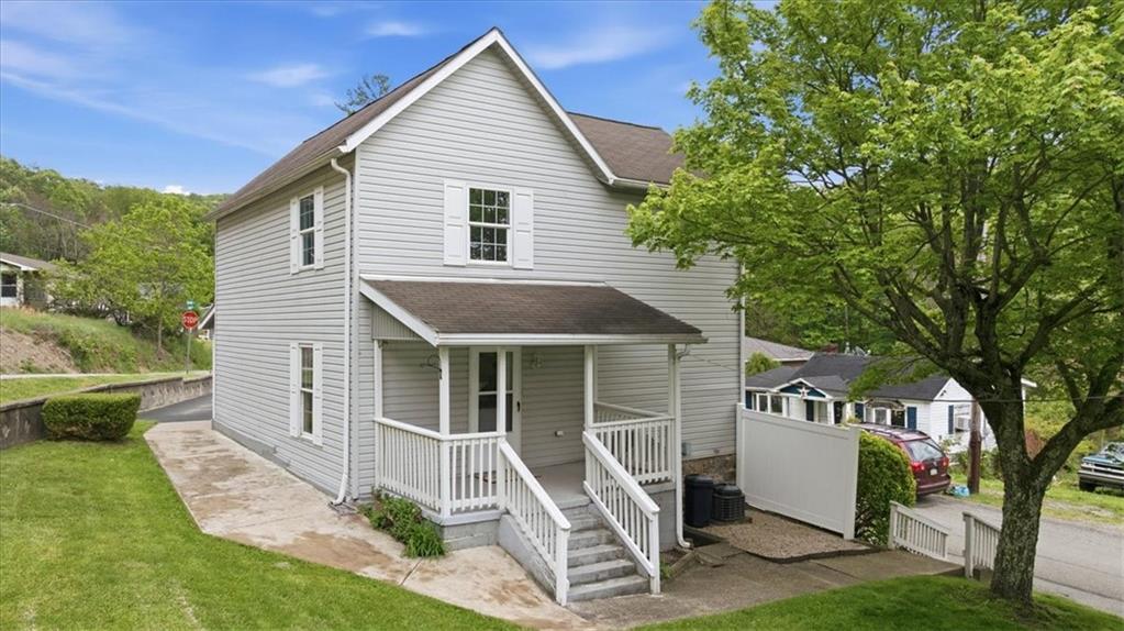 470 Reidmore Road Connellsville, PA 15425 - Photo 5 of 29 a front view of a house with a yard