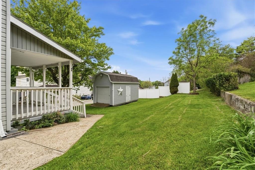 470 Reidmore Road Connellsville, PA 15425 - Photo 6 of 29 a front view of a house with a yard and garage