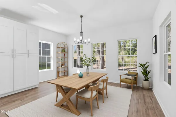 a dining room with furniture window wooden floor
