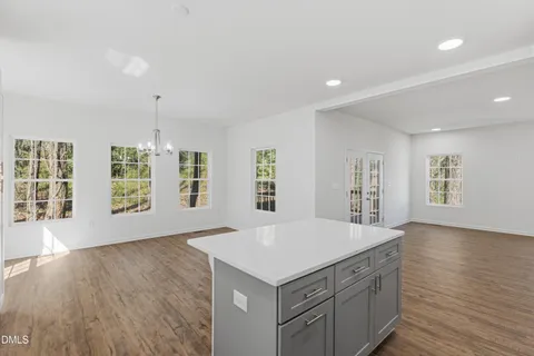 an empty room with windows and entrance