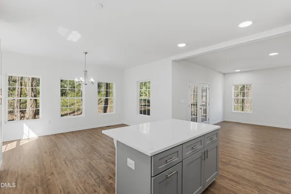 an empty room with windows and entrance