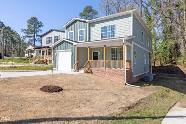 a view of a house with a sink and yard