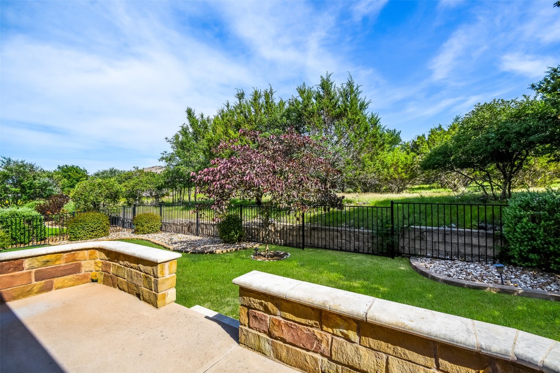 a view of a park with large trees