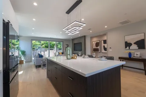 a view of living room with granite countertop furniture and fireplace