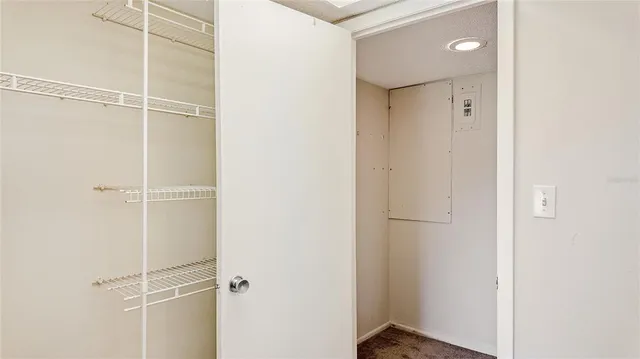 a view of a porch with a table and chairs