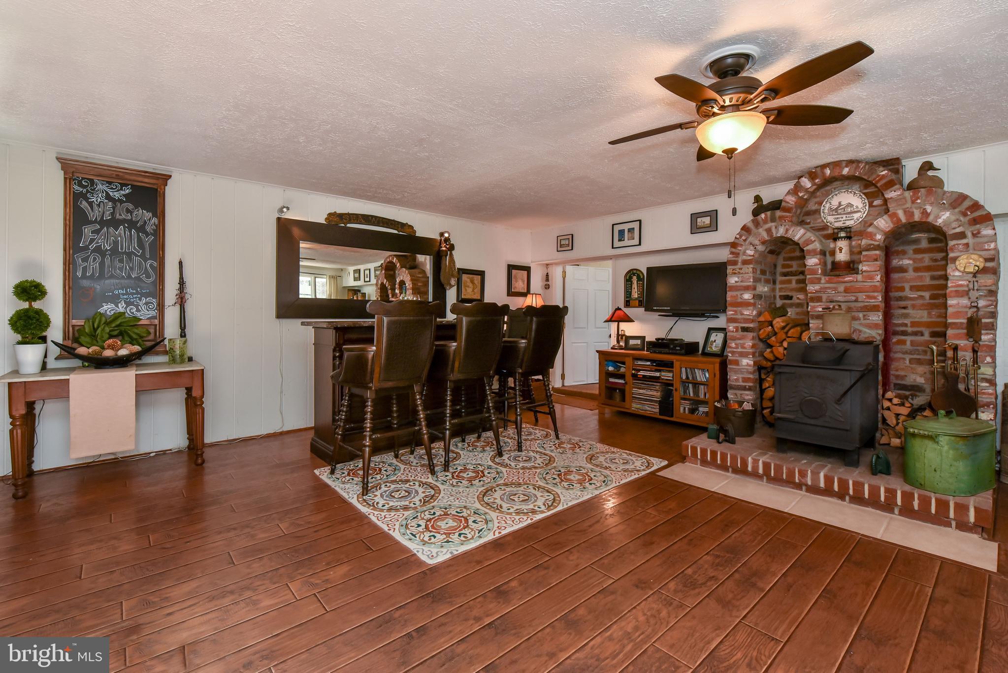 79 Knollwood Road Elkton, MD 21921 - Photo 14 of 40 View #2 of den with stove & custom brick surround
