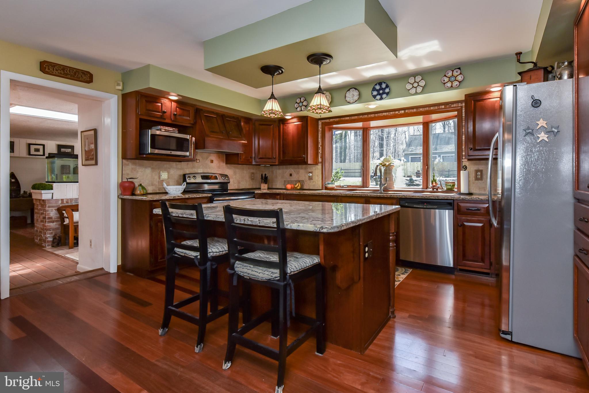 79 Knollwood Road Elkton, MD 21921 - Photo 16 of 40 Center island and Mahogany flooring--has a view