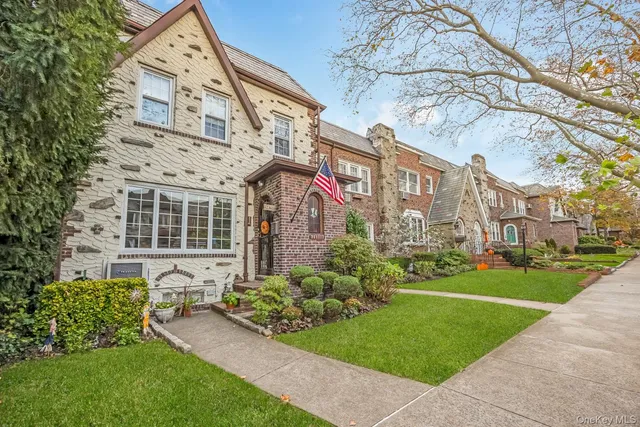 a front view of a building with garden