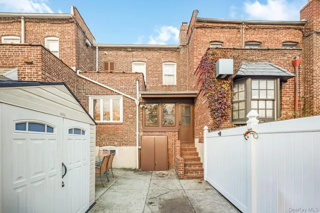a front view of a house with large windows