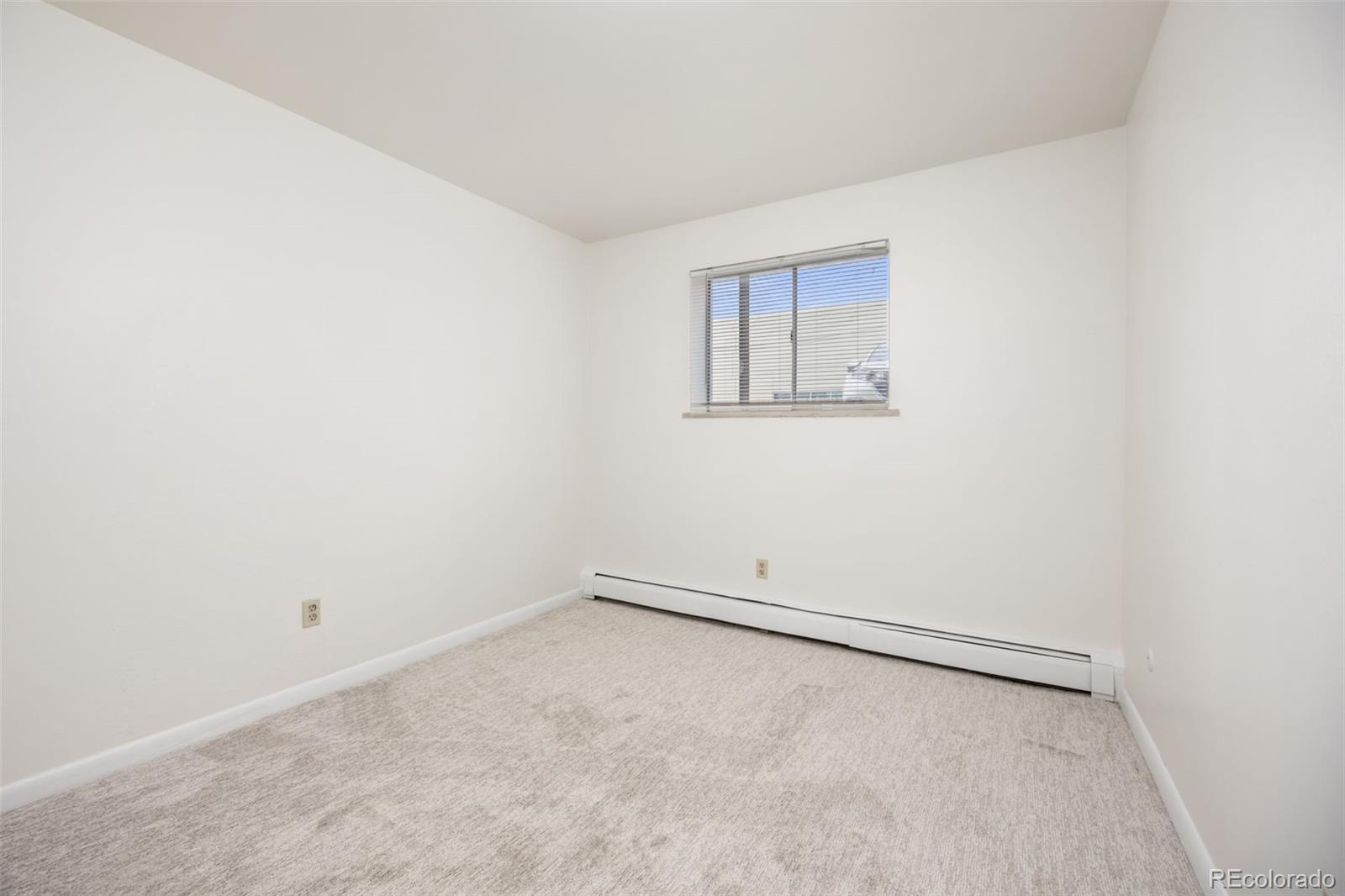 9380 West 49th Avenue, Unit 101 Wheat Ridge, CO 80033 - Photo 11 of 15 a view of a room with an empty space