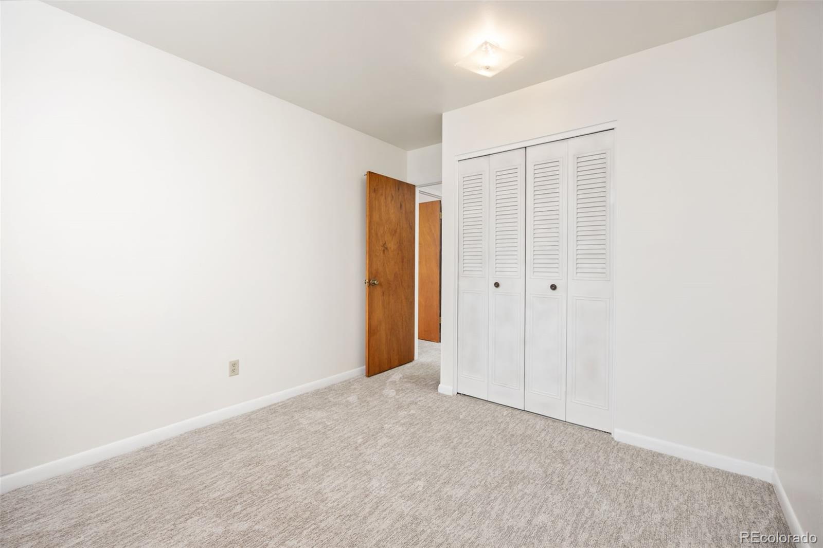 9380 West 49th Avenue, Unit 101 Wheat Ridge, CO 80033 - Photo 13 of 15 a view of an empty room