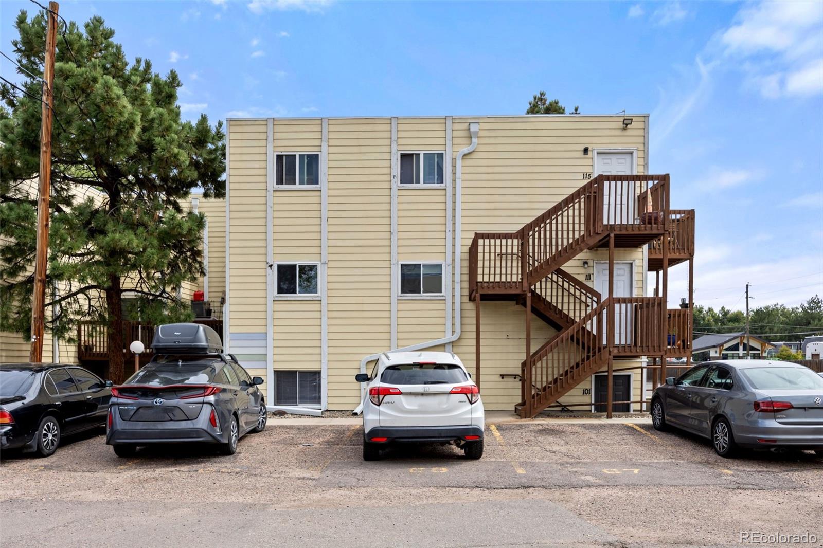 9380 West 49th Avenue, Unit 101 Wheat Ridge, CO 80033 - Photo 15 of 15 a car parked in front of a house