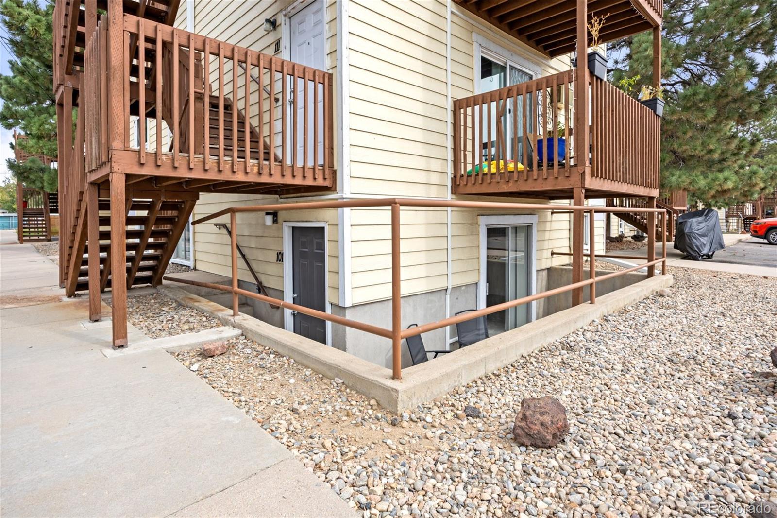 9380 West 49th Avenue, Unit 101 Wheat Ridge, CO 80033 - Photo 4 of 15 a view of a house with wooden fence