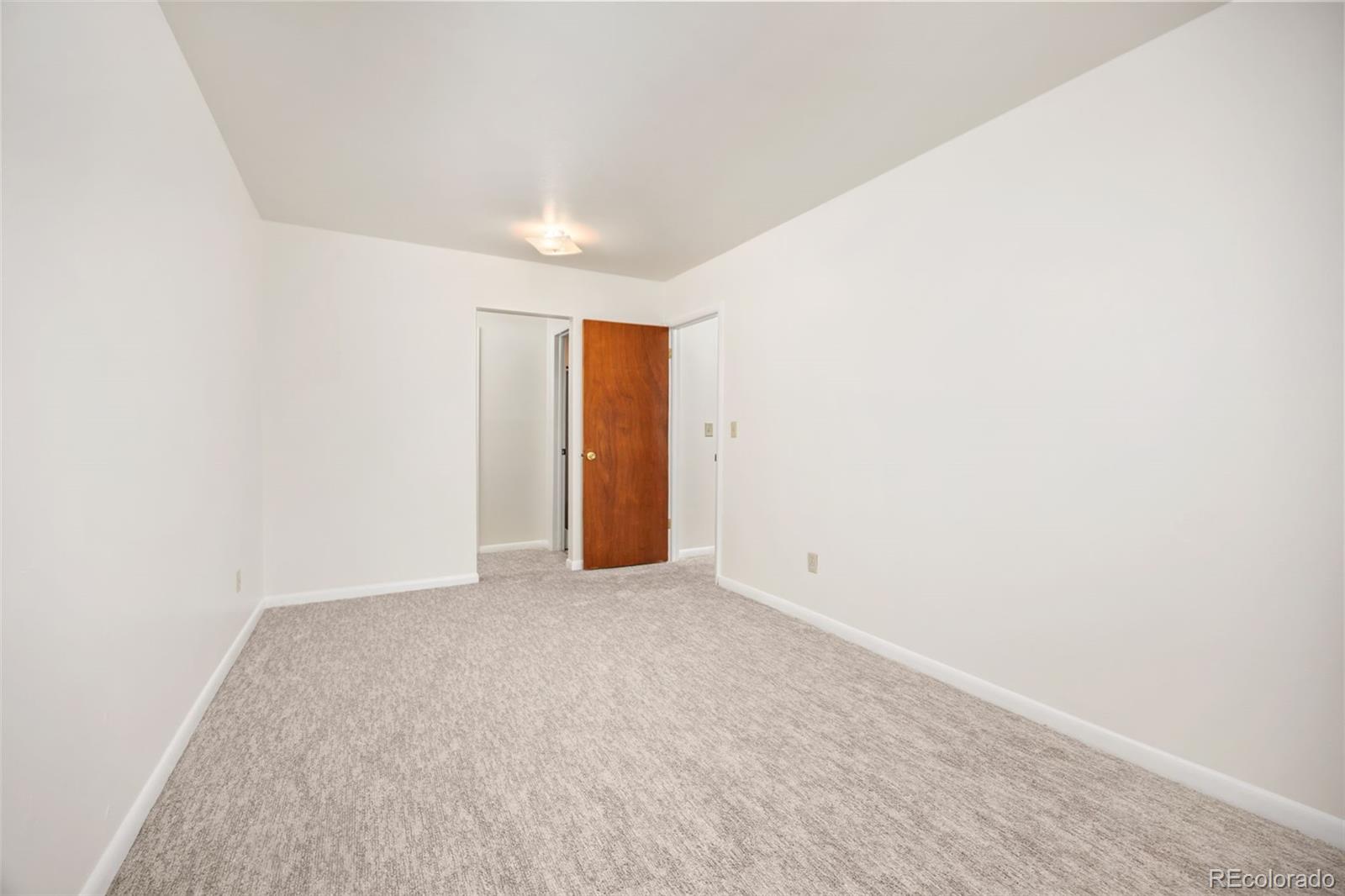 9380 West 49th Avenue, Unit 101 Wheat Ridge, CO 80033 - Photo 10 of 15 a view of an empty room