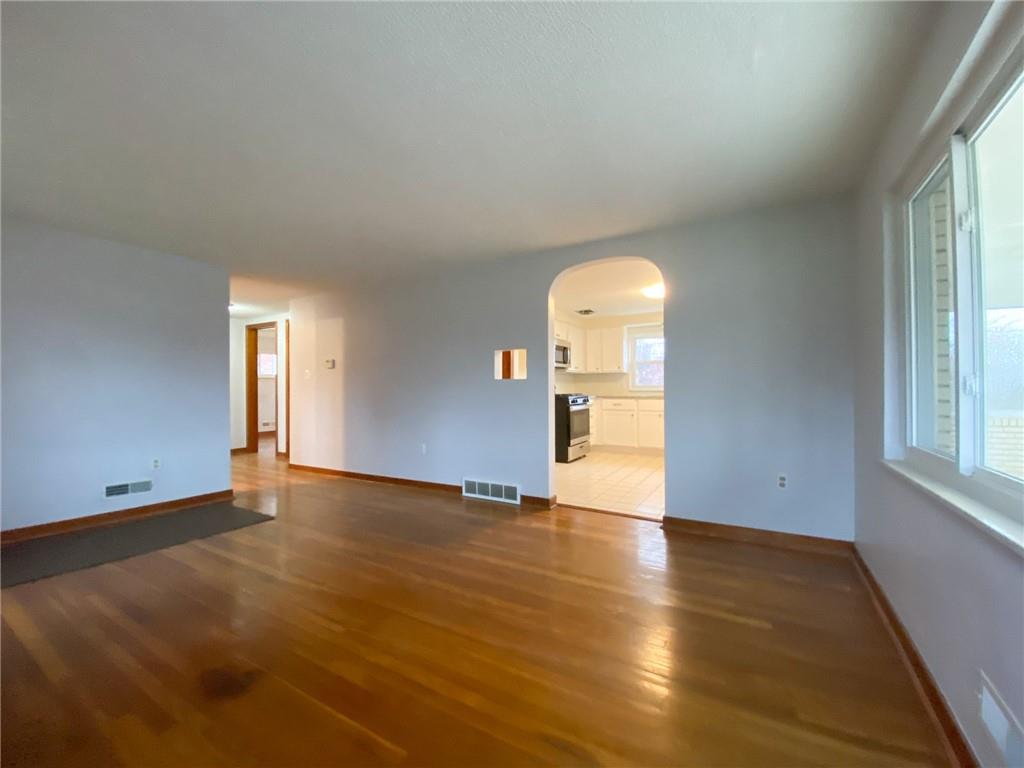 151 Thorne Road Washington, PA 15301 - Photo 11 of 25 an empty room with wooden floor and windows