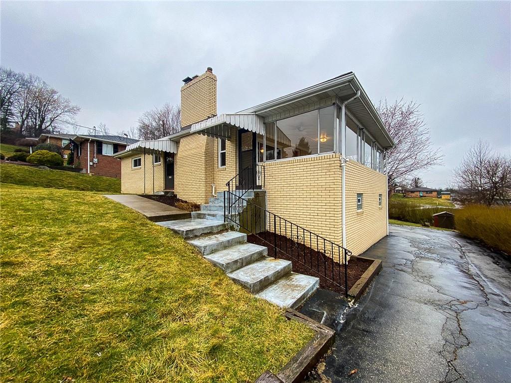 151 Thorne Road Washington, PA 15301 - Photo 3 of 25 a front view of a house with garden