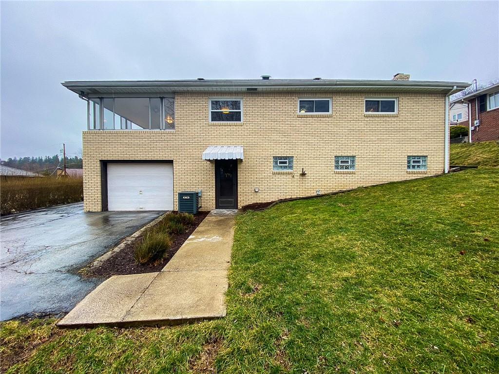 151 Thorne Road Washington, PA 15301 - Photo 5 of 25 a front view of a house with garage