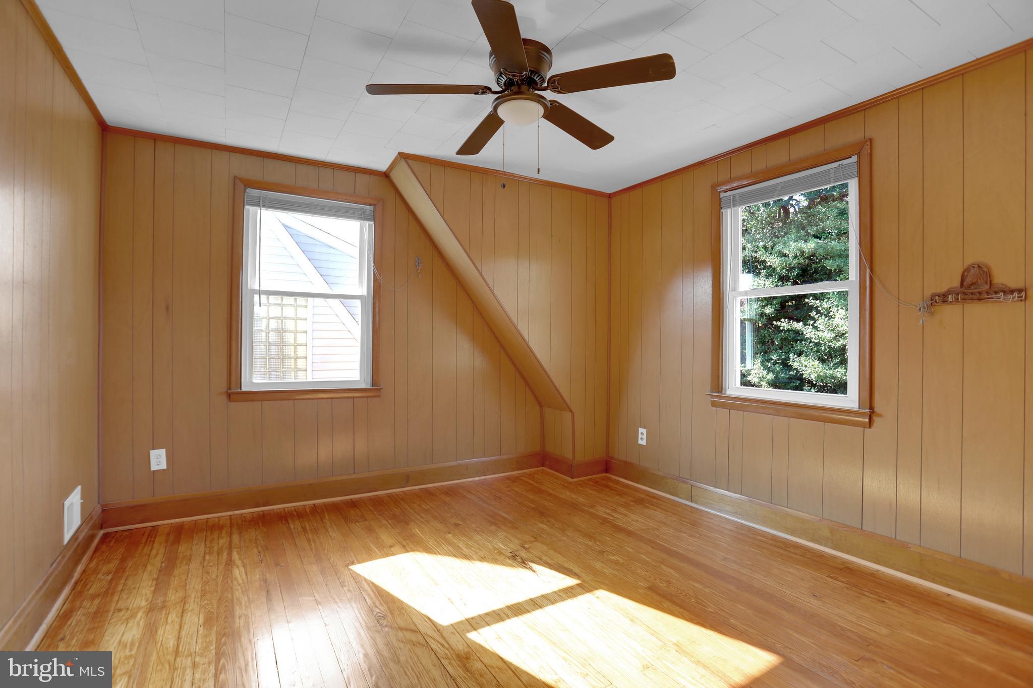 41 Township Road Dundalk, MD 21222 - Photo 19 of 40 a view of empty room with wooden floor and fan