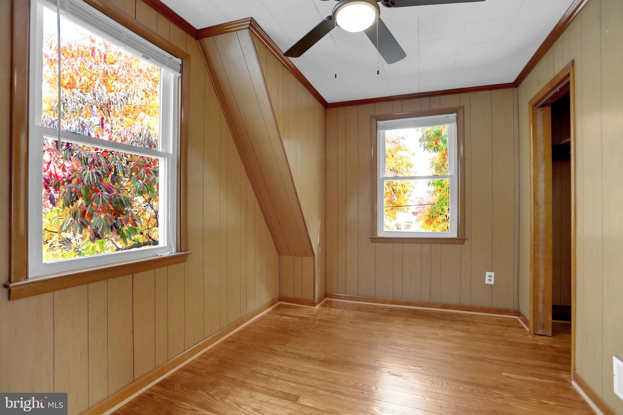 41 Township Road Dundalk, MD 21222 - Photo 22 of 40 a view of an empty room with wooden floor and a window