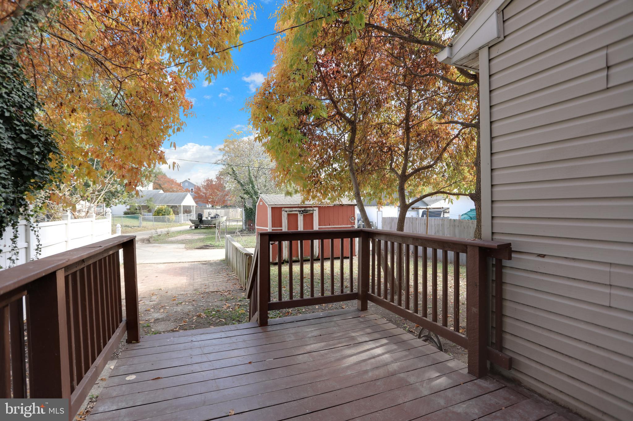 41 Township Road Dundalk, MD 21222 - Photo 30 of 40 a view of a deck with wooden floor and fence next to a yard
