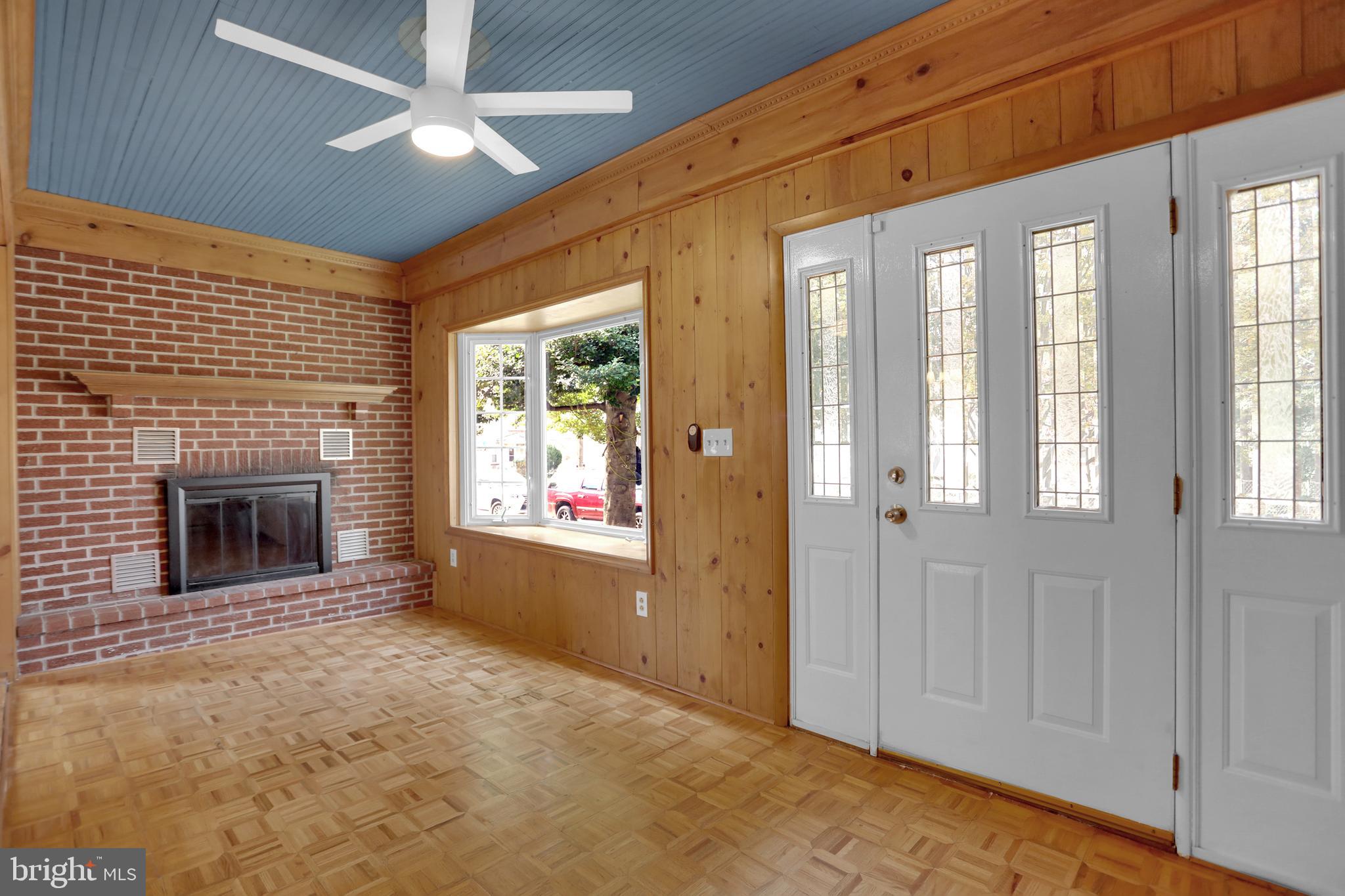 41 Township Road Dundalk, MD 21222 - Photo 5 of 40 a view of an empty room with window and fire place