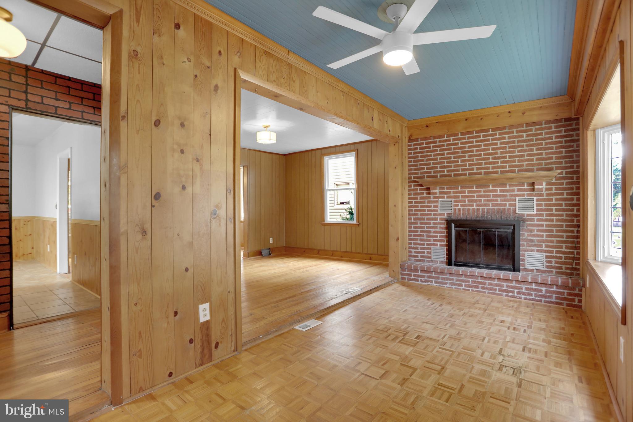41 Township Road Dundalk, MD 21222 - Photo 6 of 40 a view of an empty room with a fireplace and a window