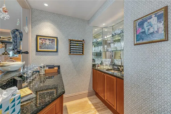 a kitchen with stainless steel appliances granite countertop a stove a sink dishwasher and a refrigerator