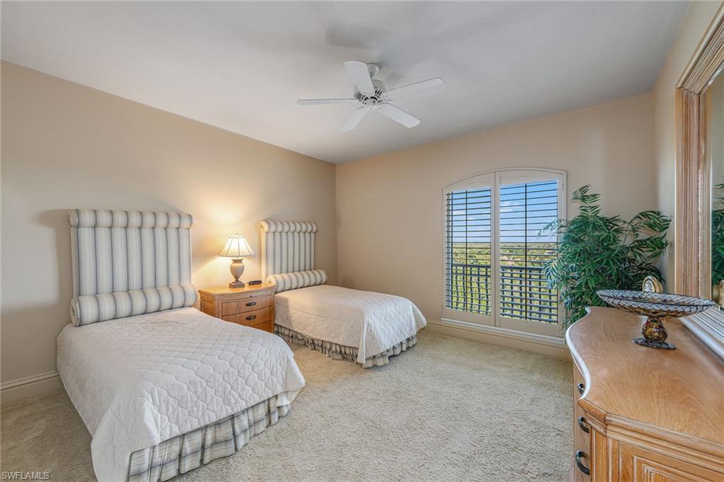 8477 Bay Colony Drive, Unit 902 Naples, FL 34108 - Photo 18 of 34 a bedroom with bed and a window