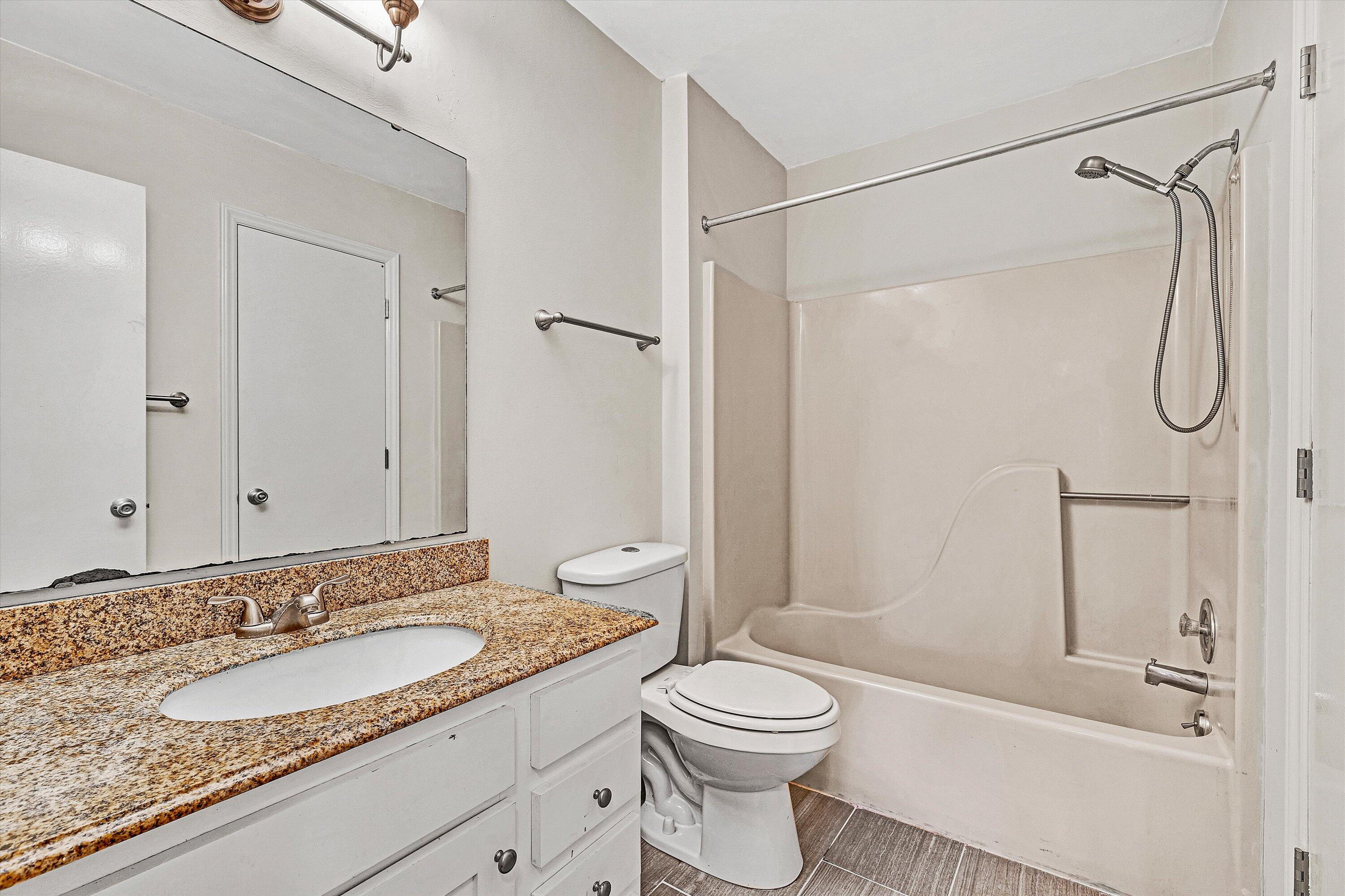3347 Forest Ridge Road Roanoke, VA 24018 - Photo 13 of 22 a bathroom with a granite countertop sink toilet and shower
