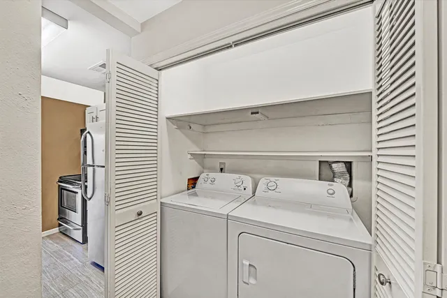 a utility room with dryer and washer