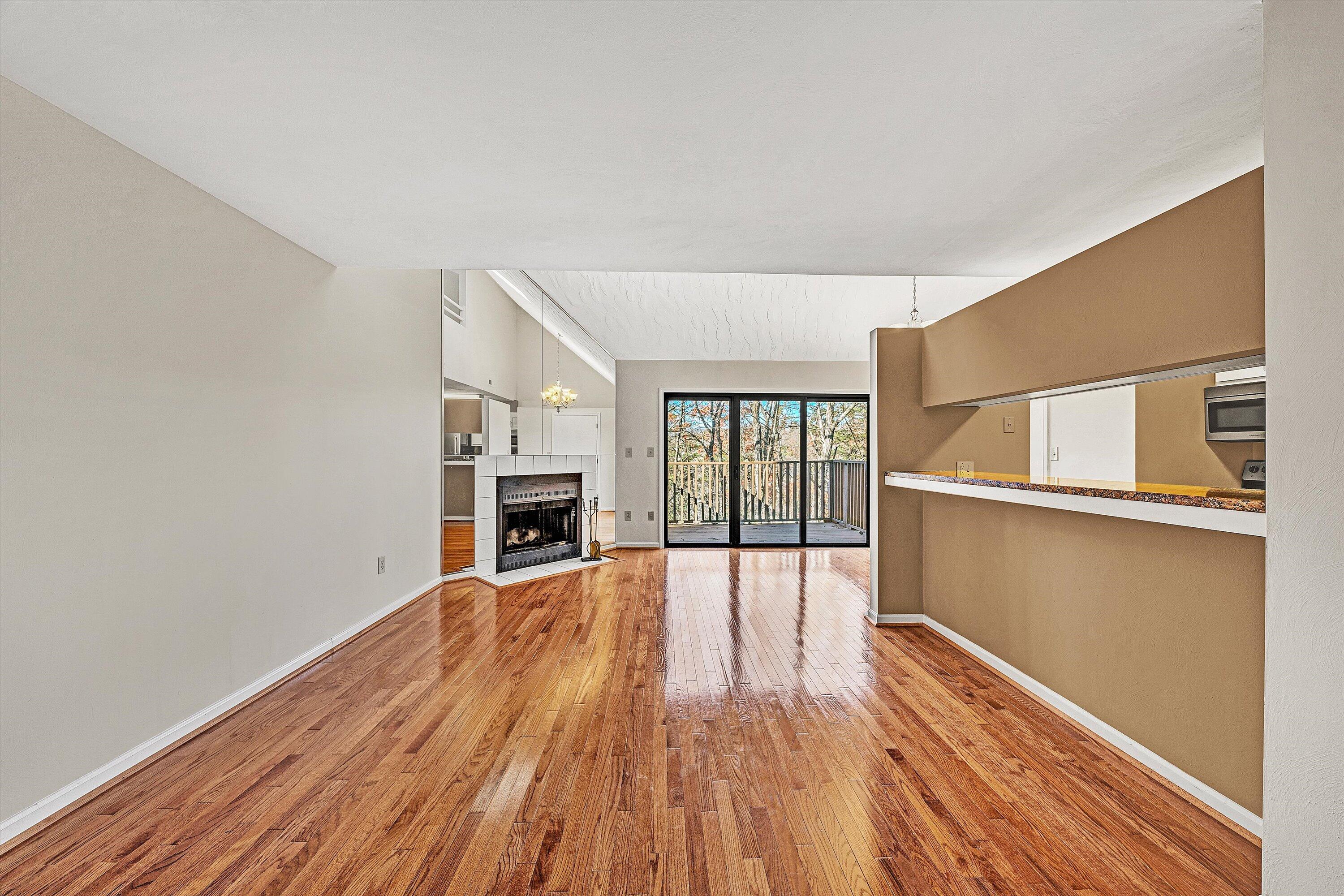 3347 Forest Ridge Road Roanoke, VA 24018 - Photo 4 of 22 a view of an empty room with wooden floor and a window