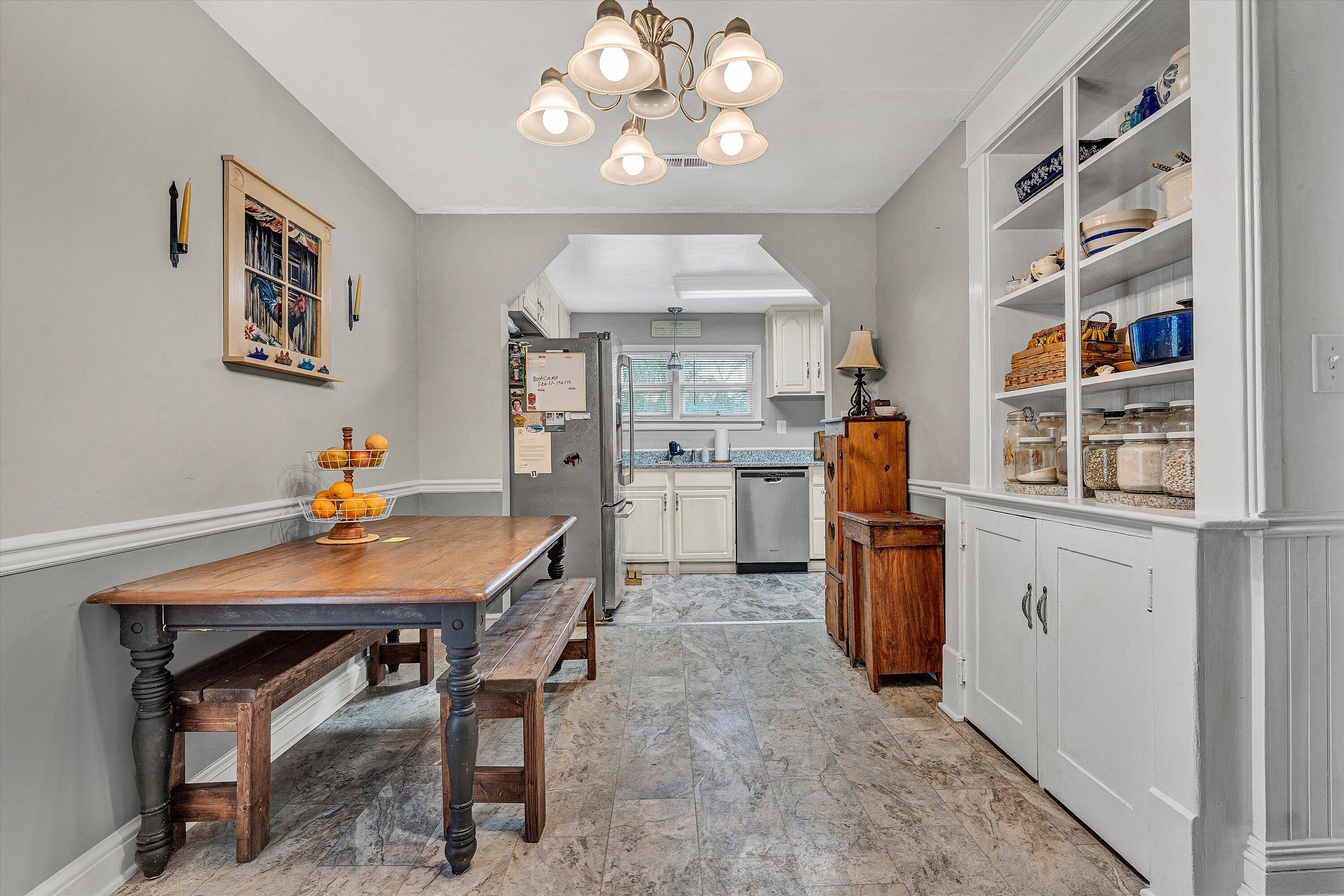 2238 Houston Mines Road Troutville, VA 24175 - Photo 11 of 36 a view of a dining room with furniture and a chandelier fan