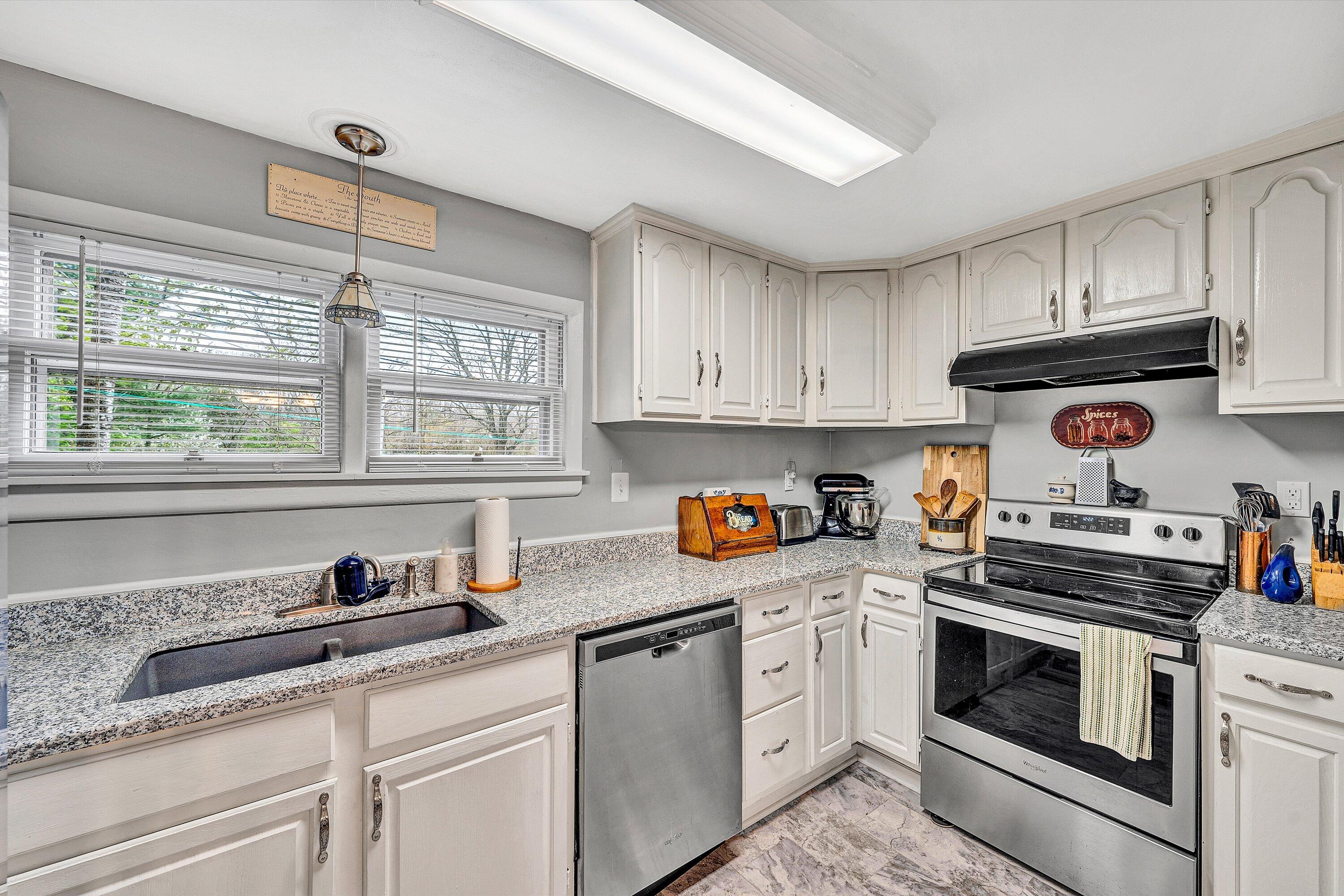 2238 Houston Mines Road Troutville, VA 24175 - Photo 12 of 36 a kitchen with granite countertop white cabinets and white appliances