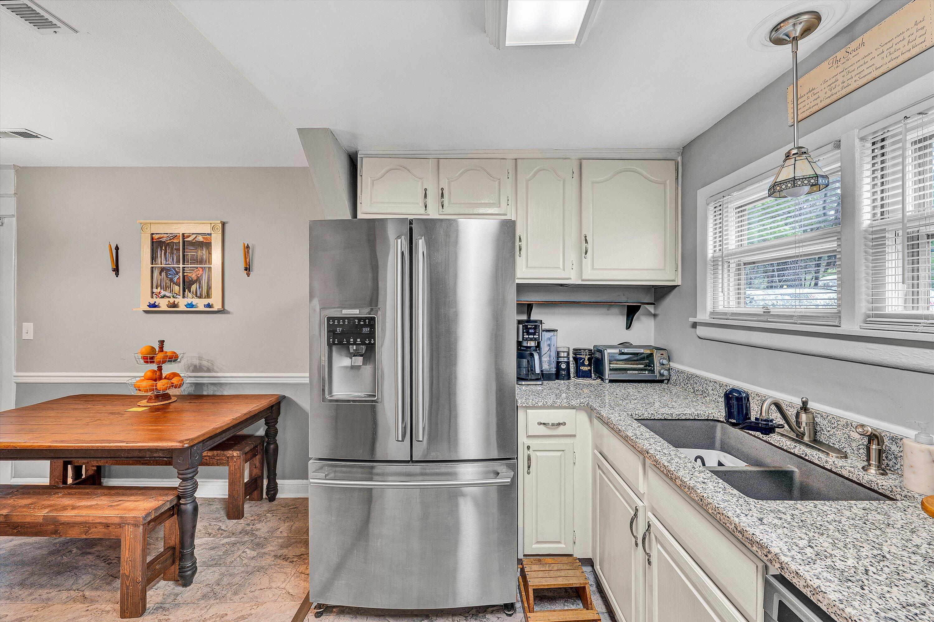 2238 Houston Mines Road Troutville, VA 24175 - Photo 13 of 36 a kitchen with stainless steel appliances granite countertop a refrigerator a sink a stove and a refrigerator