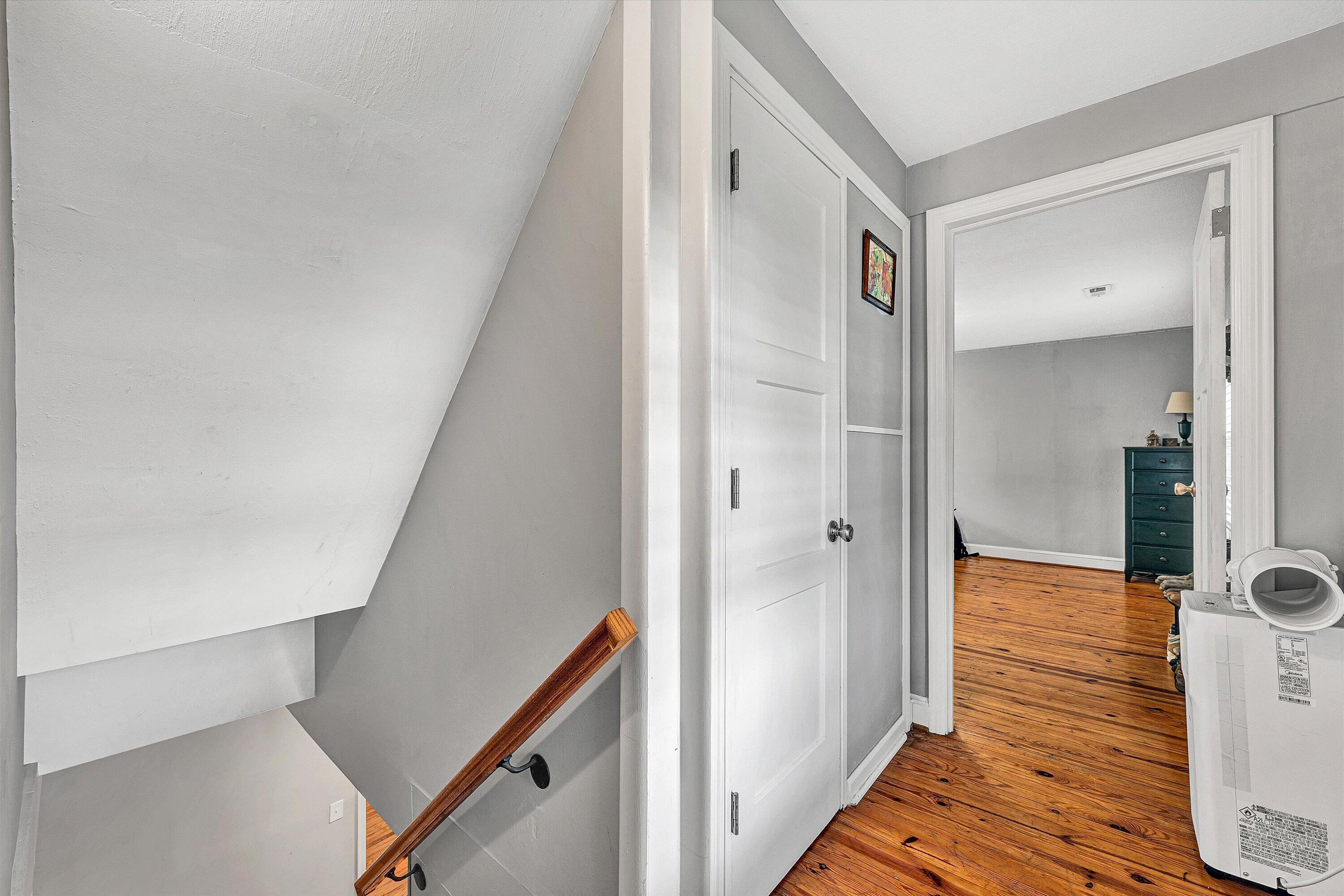 2238 Houston Mines Road Troutville, VA 24175 - Photo 14 of 36 a view of a hallway with wooden floor and staircase