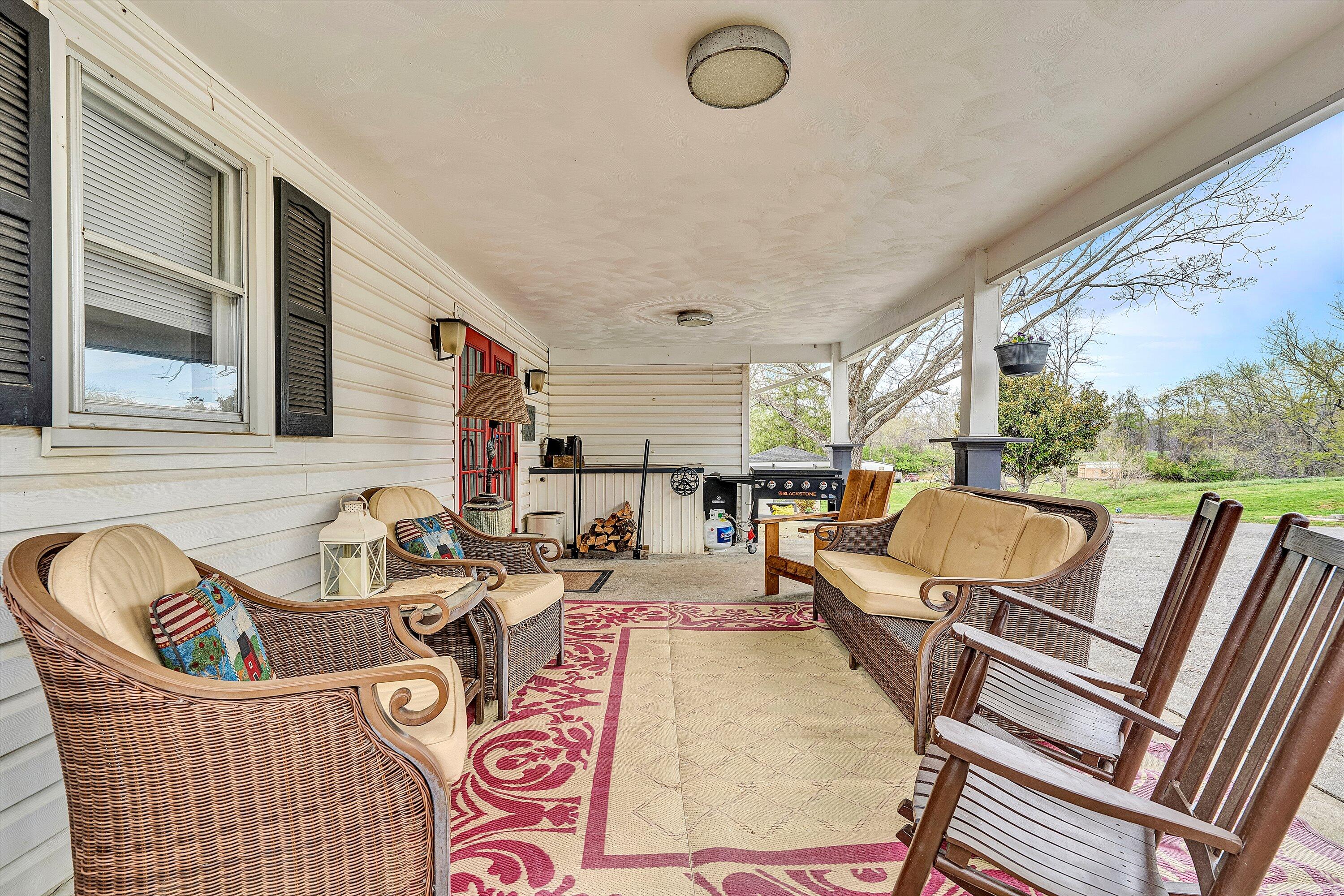 2238 Houston Mines Road Troutville, VA 24175 - Photo 20 of 36 a view of a patio with couches chairs and a barbeque