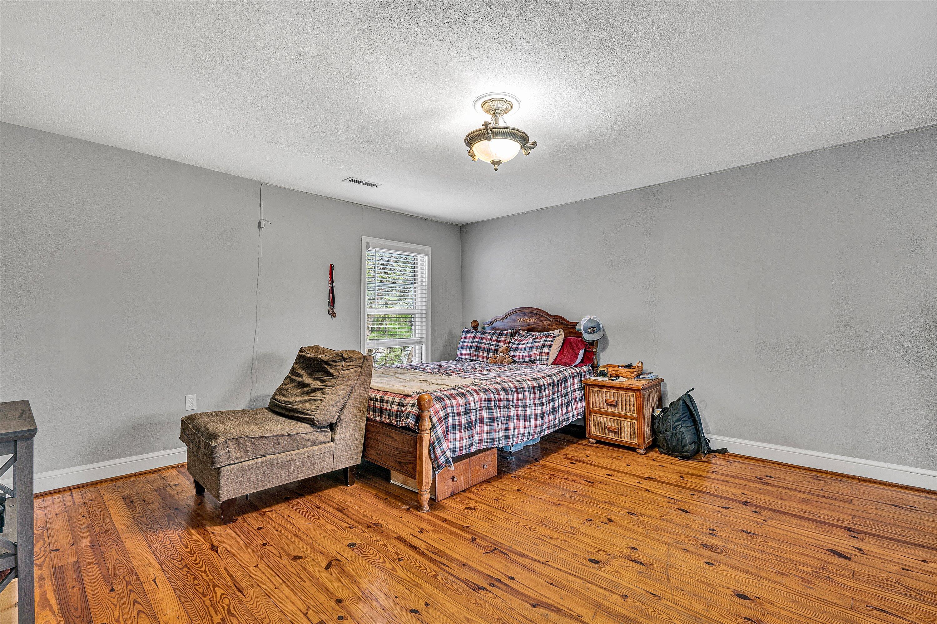 2238 Houston Mines Road Troutville, VA 24175 - Photo 21 of 36 a bedroom with furniture and wooden floor