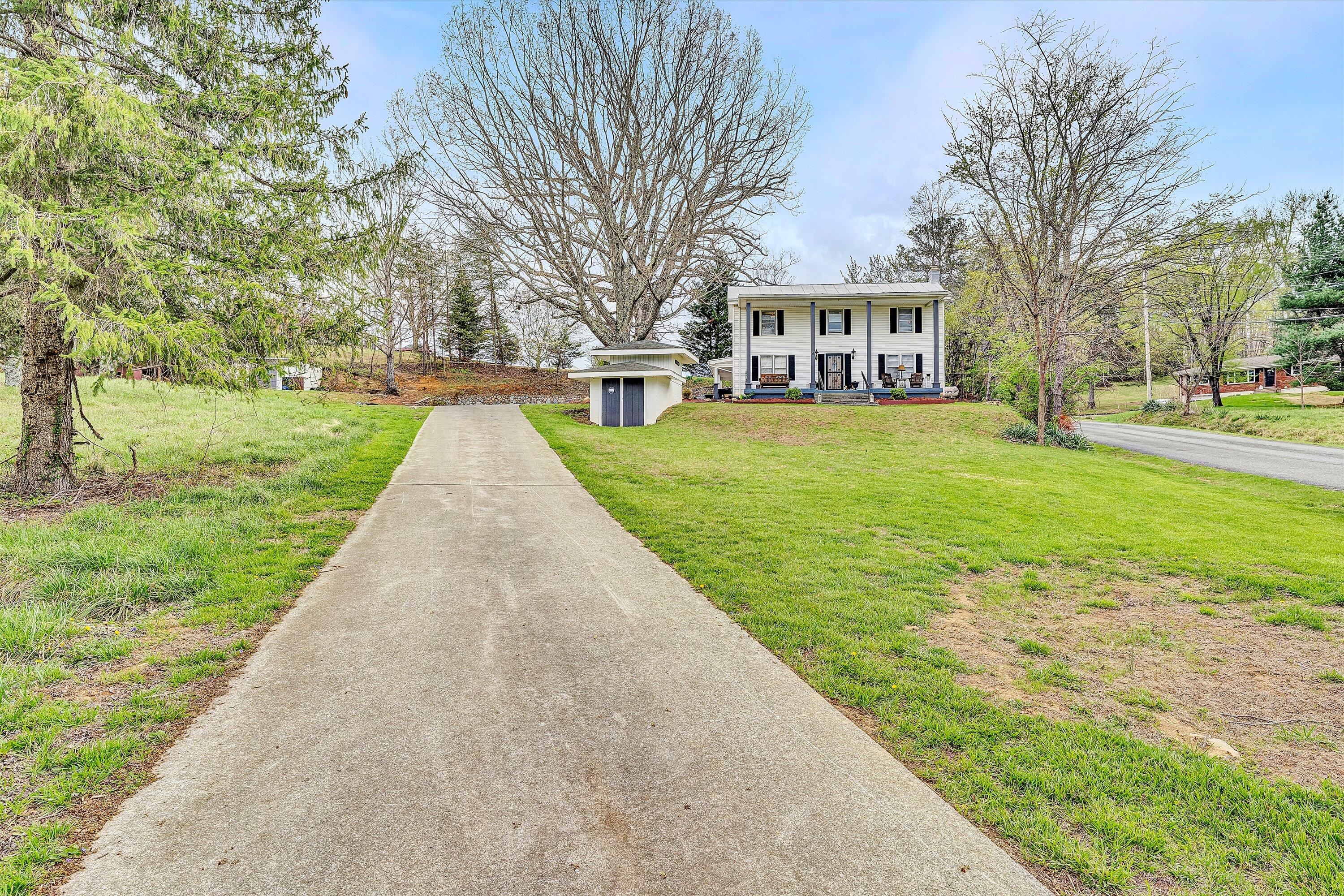 2238 Houston Mines Road Troutville, VA 24175 - Photo 26 of 36 a view of a big yard next to a house
