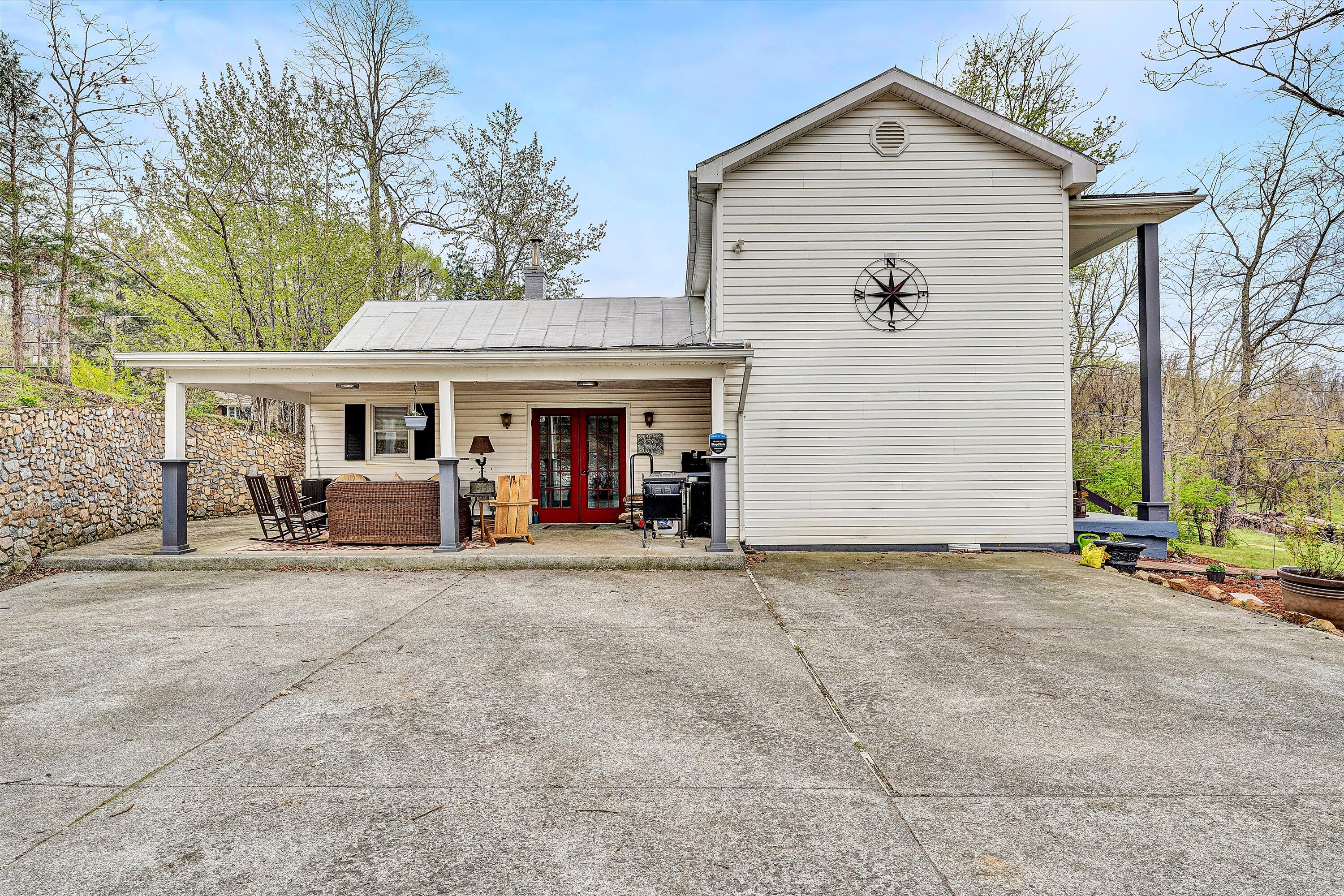 2238 Houston Mines Road Troutville, VA 24175 - Photo 28 of 36 a view of a house with a barbeque and large trees