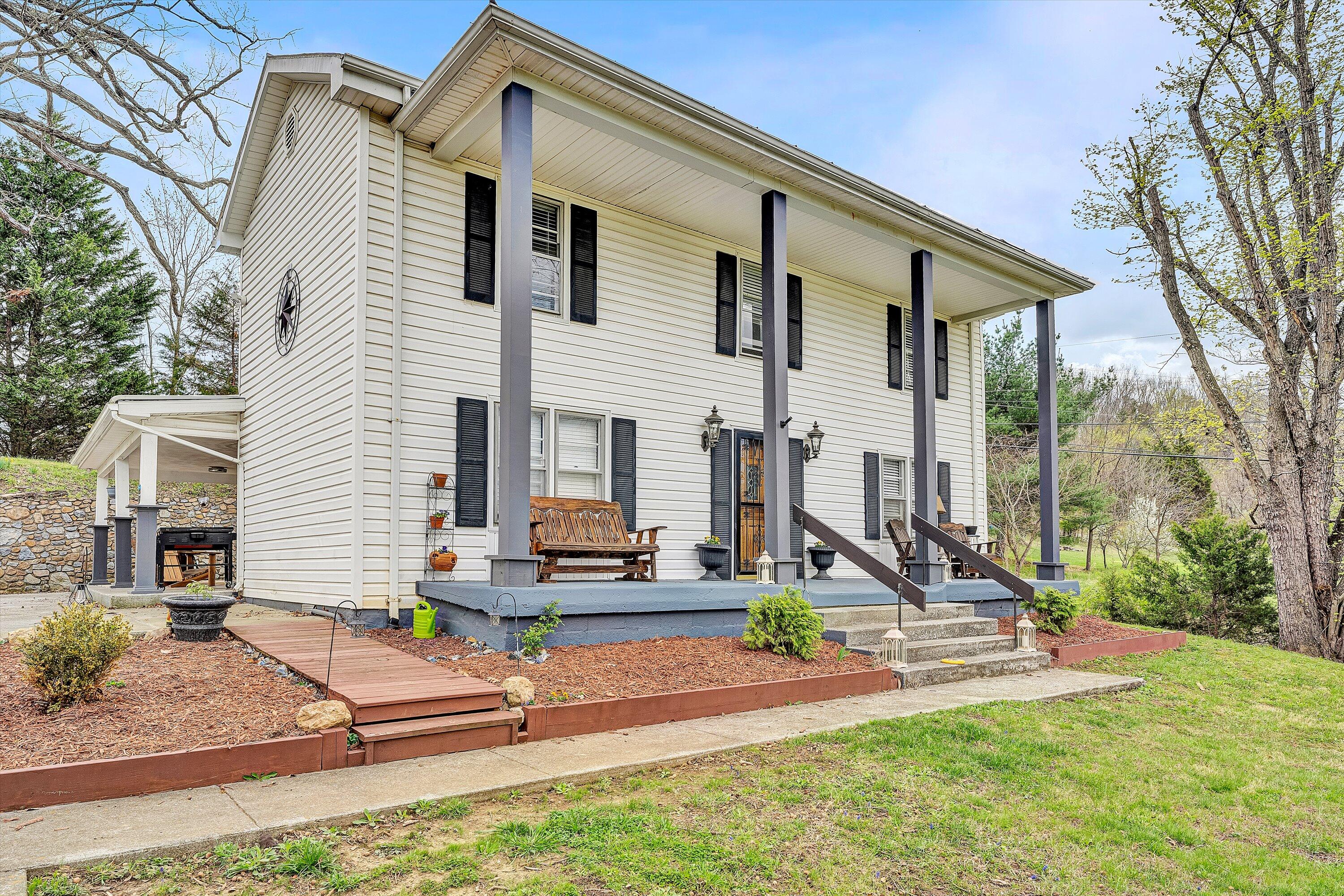 2238 Houston Mines Road Troutville, VA 24175 - Photo 3 of 36 a front view of a house with a yard