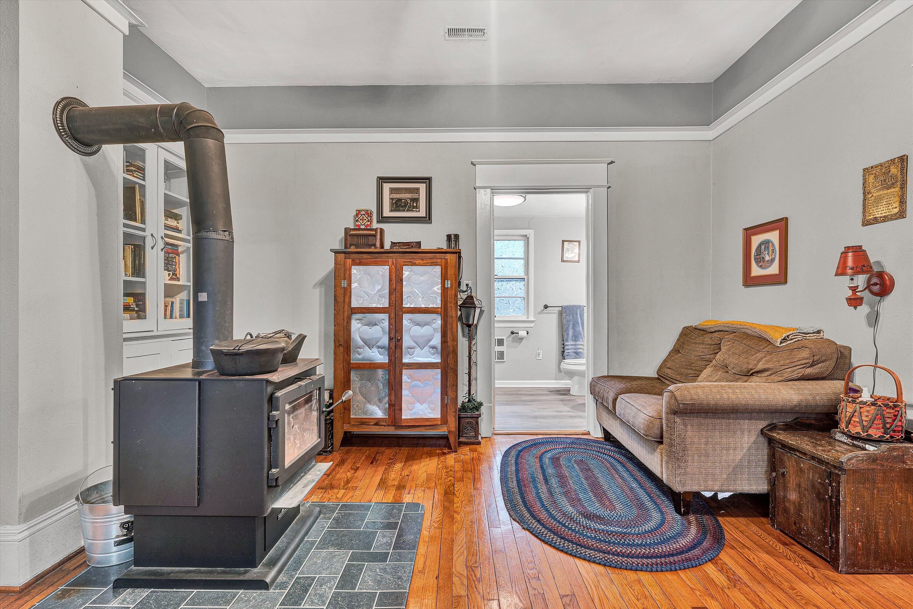 2238 Houston Mines Road Troutville, VA 24175 - Photo 10 of 36 a living room with furniture a rug and a bookshelf